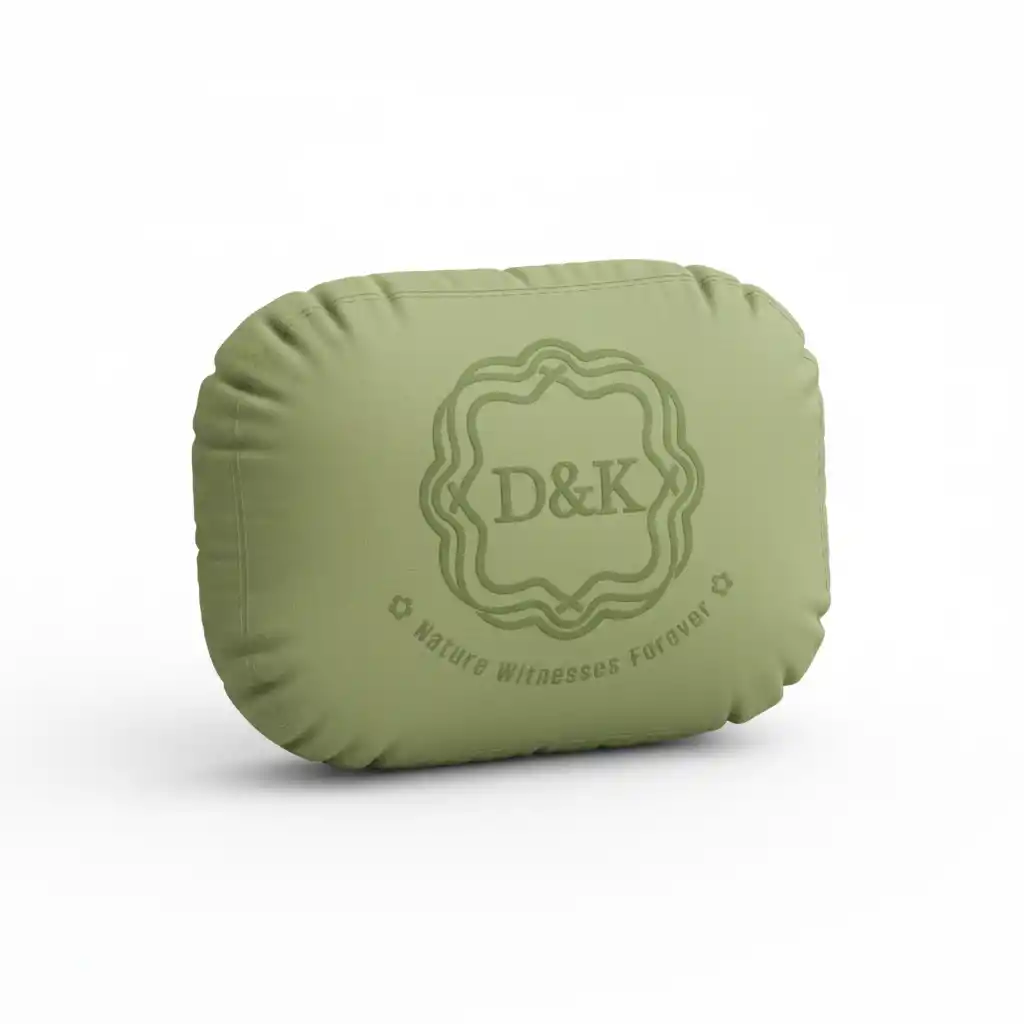 3D Plush Pillow Logo Generator-An eco-friendly monogram badge for D&K with scalloped circle, serif initials, curved 'Nature Witnesses Forever' slogan, and delicate floral accents.